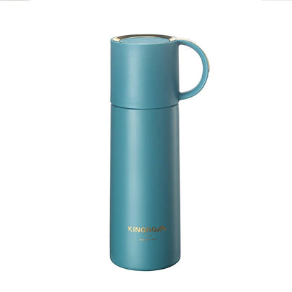 Teal insulated mug with handle on a white background