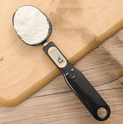 Digital measuring spoon with a wooden background