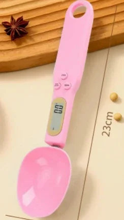 Pink digital measuring spoon on a wooden surface