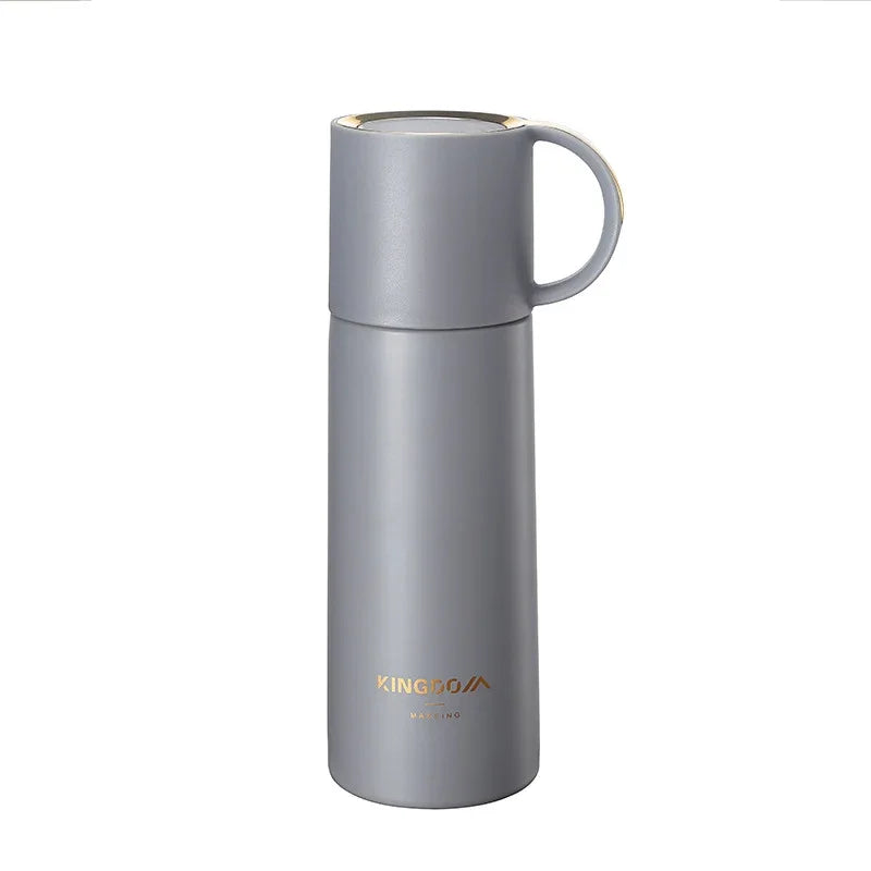 A gray stainless steel travel mug with a matching lid and handle, featuring the KINGOO brand name printed in gold near the bottom, set against a plain white background.