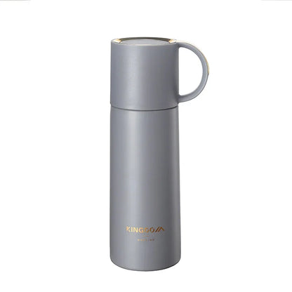 A gray stainless steel travel mug with a matching lid and handle, featuring the KINGOO brand name printed in gold near the bottom, set against a plain white background.