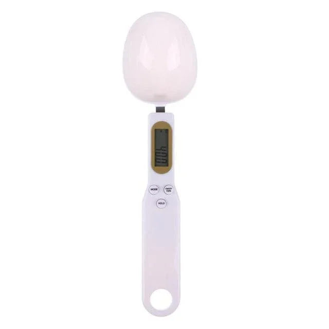 Digital kitchen scale with a white bowl on a white background