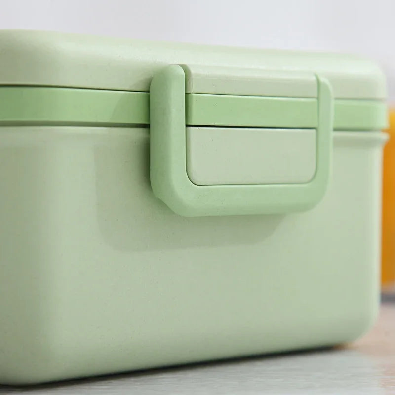 Green lunch box on a white background
