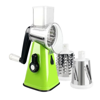 Green manual rotary cheese grater with additional attachments on a white background
