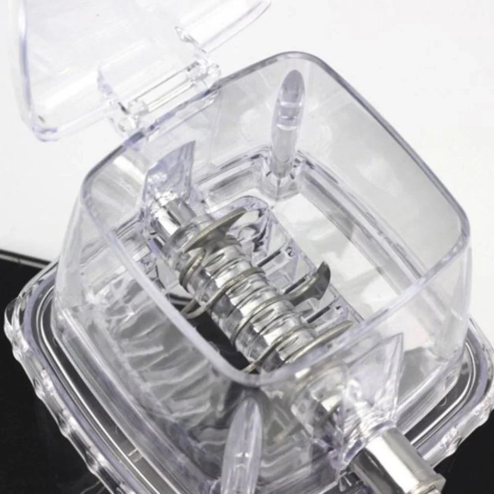 Close-up of a clear mechanical device with a spring inside, on a white background.