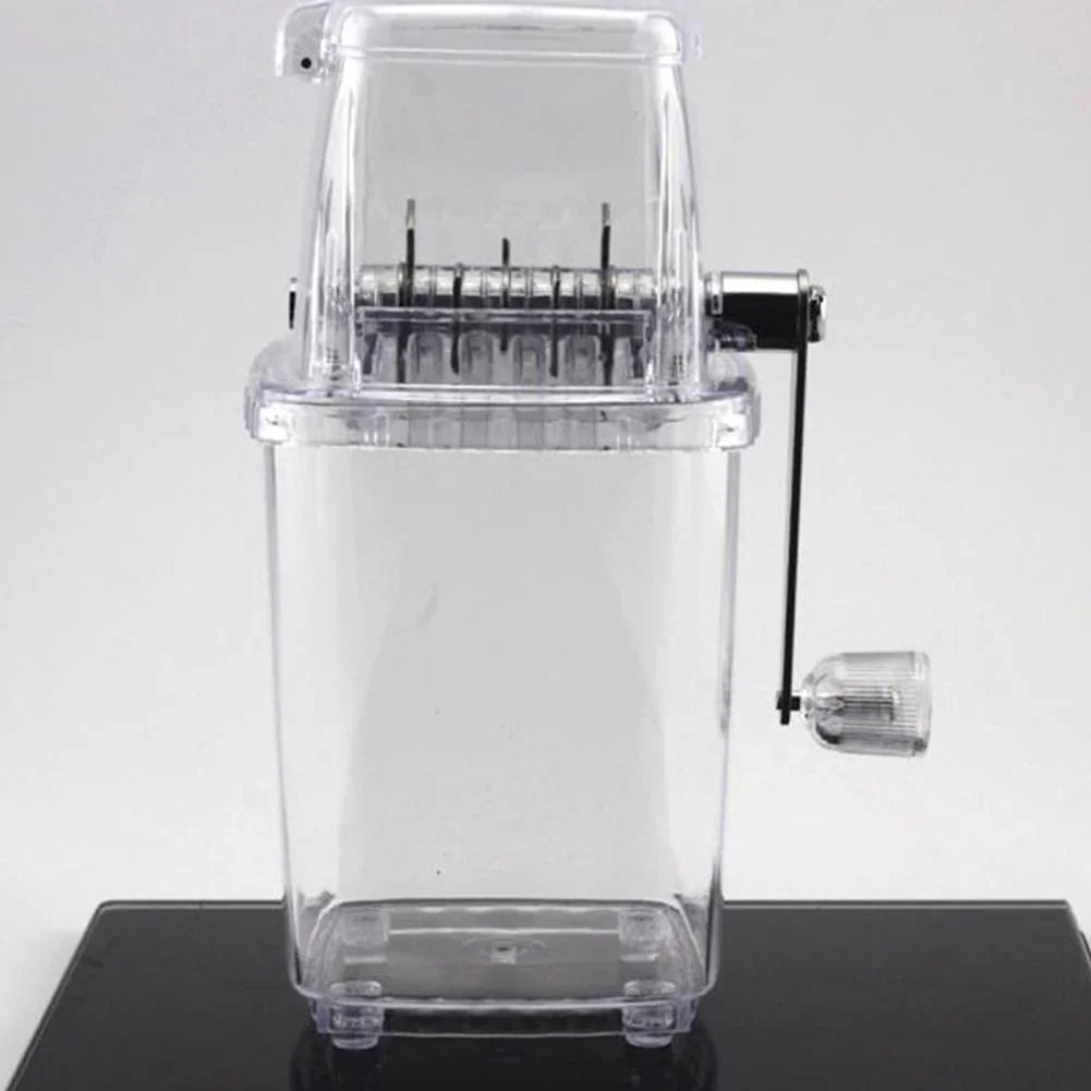 Clear pasta maker on a black surface with a white background