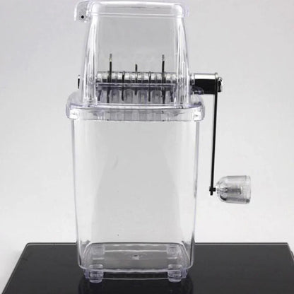 Clear pasta maker on a black surface with a white background