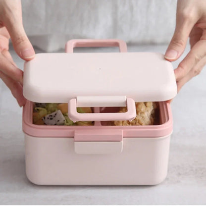 Pink bento box with food inside on a light background