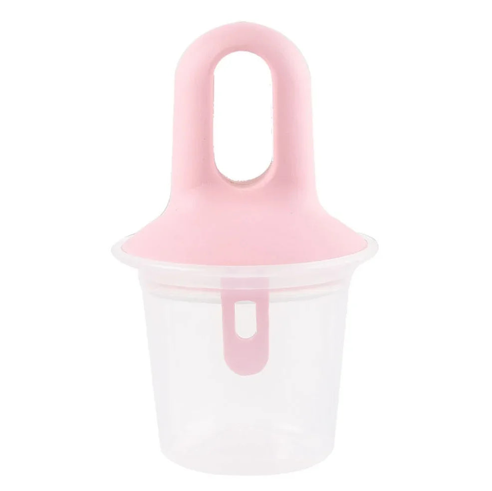 A pink silicone ice pop mold with a clear plastic container base, shown on a solid white background.