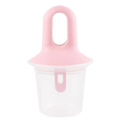 A pink silicone ice pop mold with a clear plastic container base, shown on a solid white background.