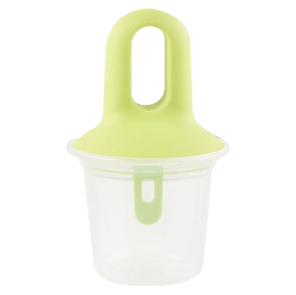 A clear plastic cup with a light green lid featuring a loop handle and a matching green latch, shown on a plain white background.