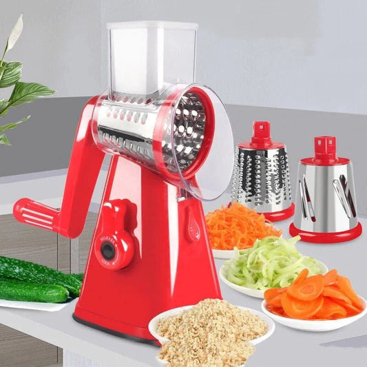 Red manual vegetable chopper with various vegetables on a table