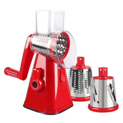 Red manual rotary cheese grater with two additional grating drums on a white background